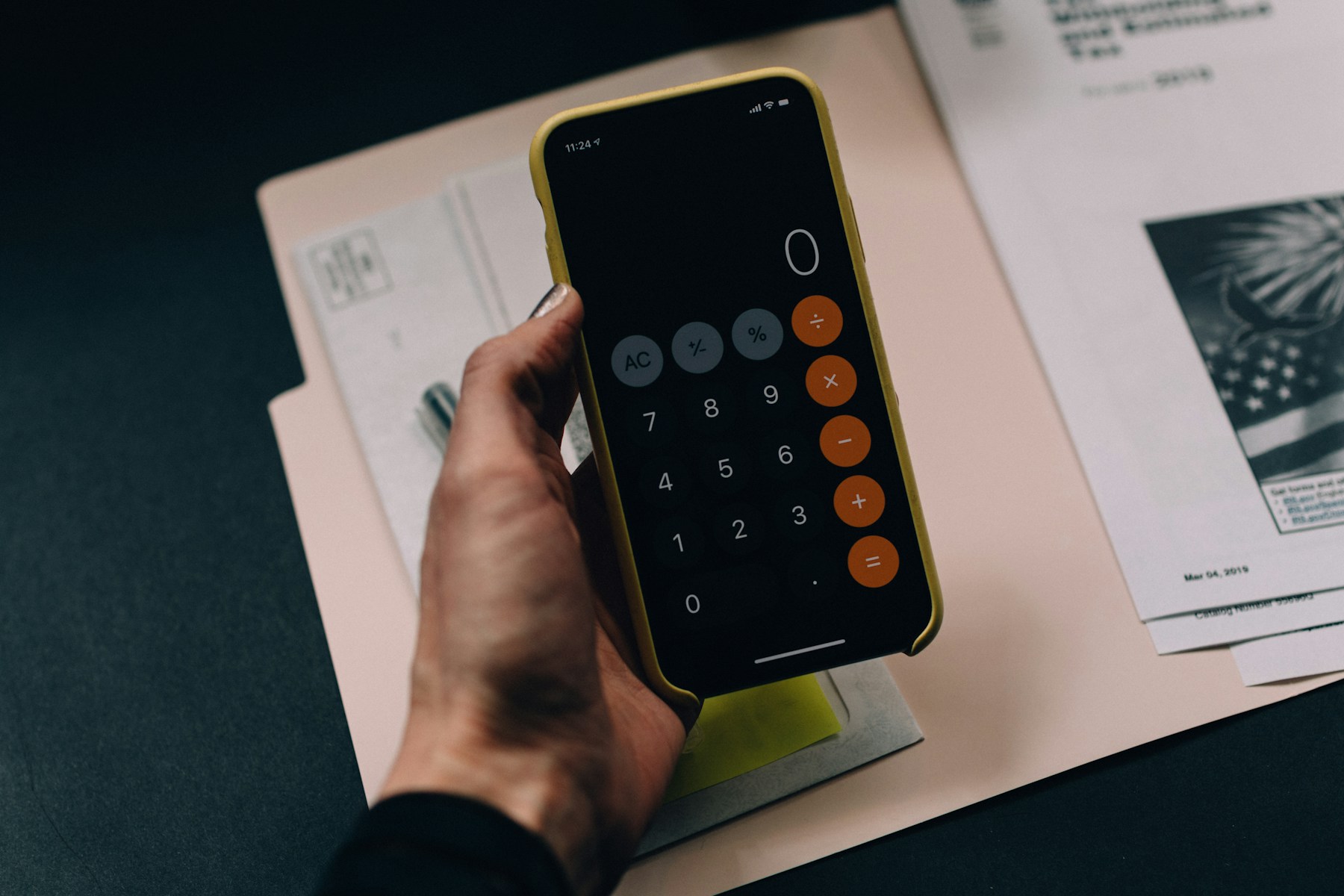 A ledger beside a cup